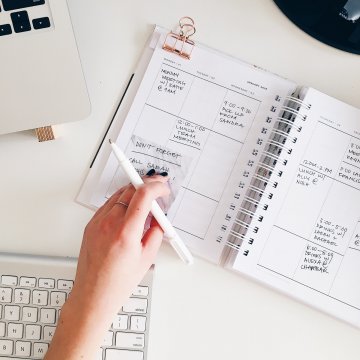 setting out the dates and events in a notebook
